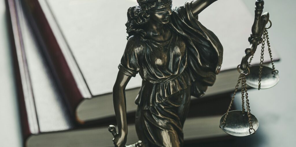 Statue of the figure of Justice holding scales